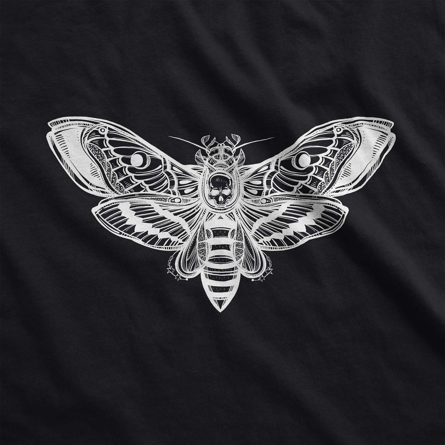 A black District 7501 swatch featuring a silhouette of a death's head moth.