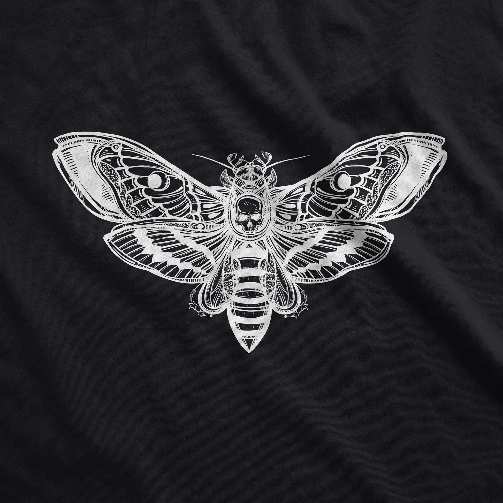 A black District 7501 swatch featuring a silhouette of a death's head moth.