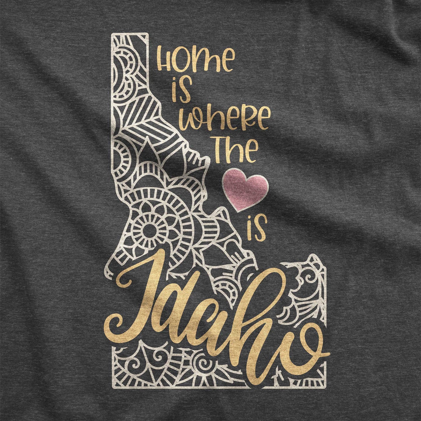 A dark grey heather Bella Canvas swatch featuring a mandala in the shape of Idaho with the words home is where the heart is.
