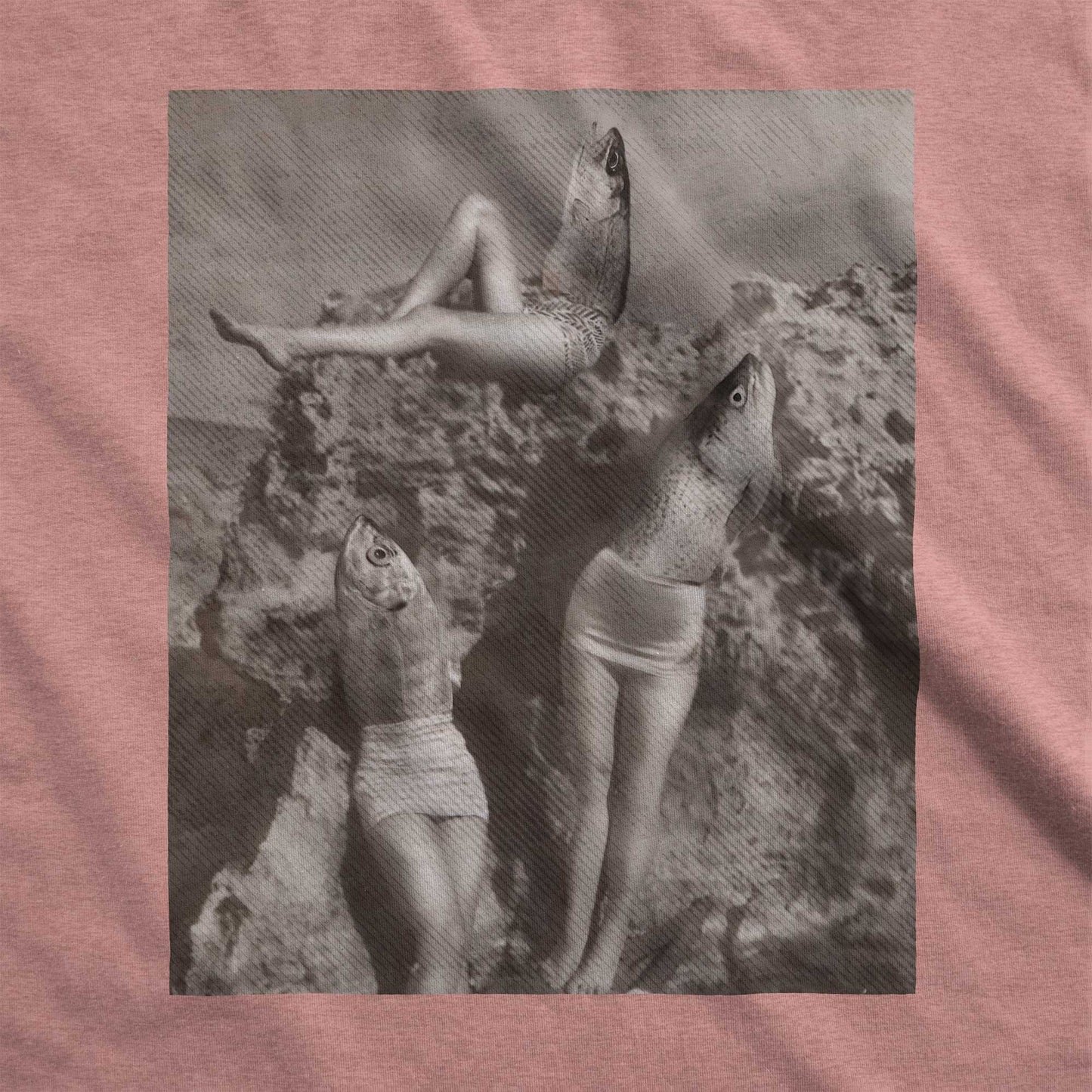 A heather mauve Bella Canvast swatch featuring an altered photo of reverse mermaids where the legs are that of a woman and the head and torso is that of a fish.