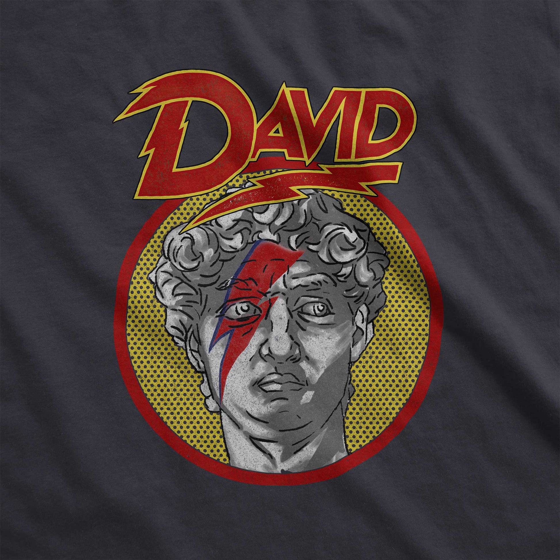 A vintage black Bella Canvas swatch featuring the face of Michelangelo's sculpture of David with a lightning bolt across his face.