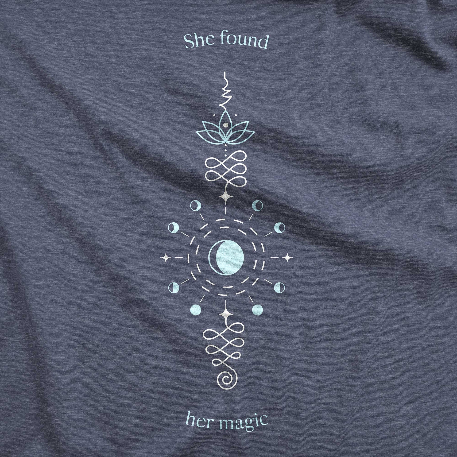 A vintage navy Next Level swatch featuring a unalome symbol with the words she found her magic.