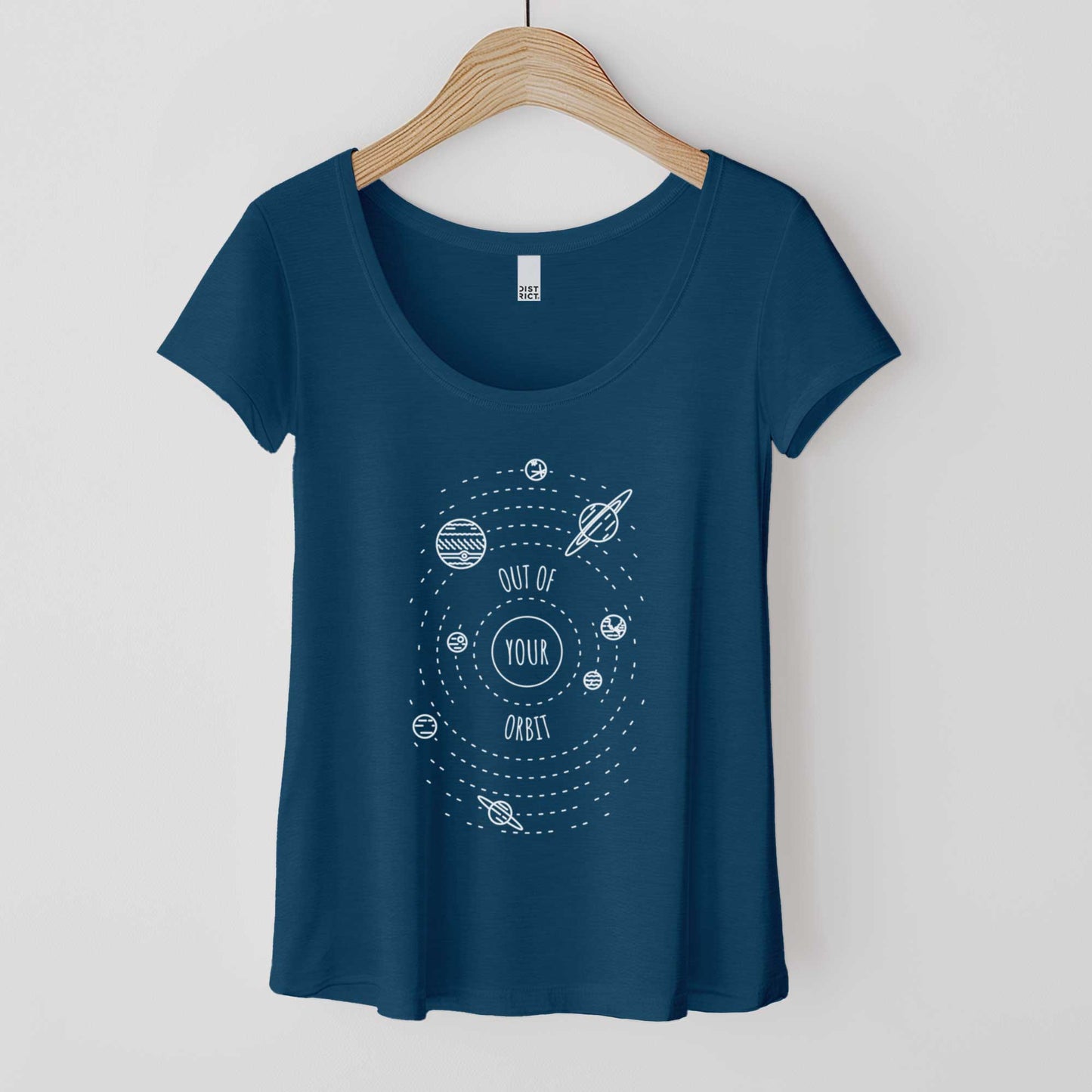 A hanging heathered neptune blue District 7501 scoop neck t-shirt featuring a hand sketch of the planets orbiting around the sun with the words out of your orbit in the center.