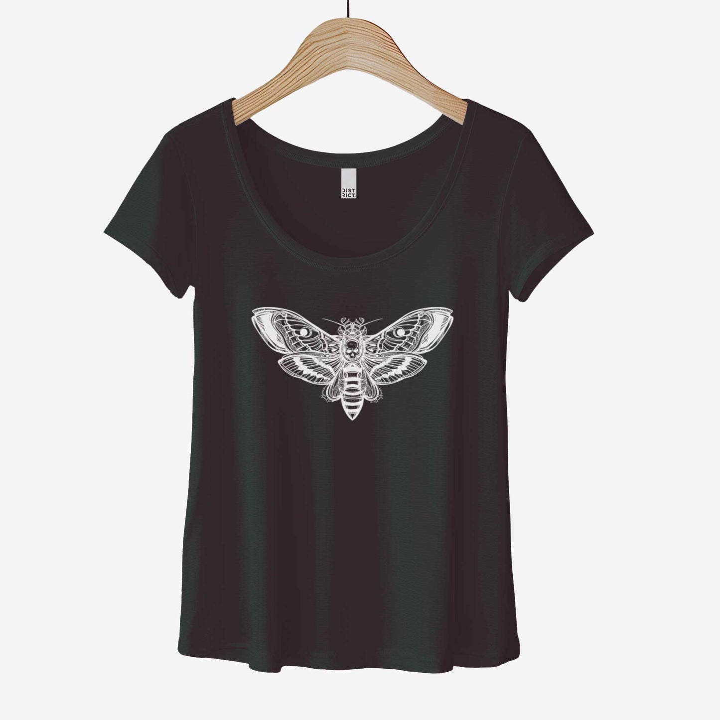A hanging black District 7501 scoop neck t-shirt featuring a white silhouette of a death's head moth.