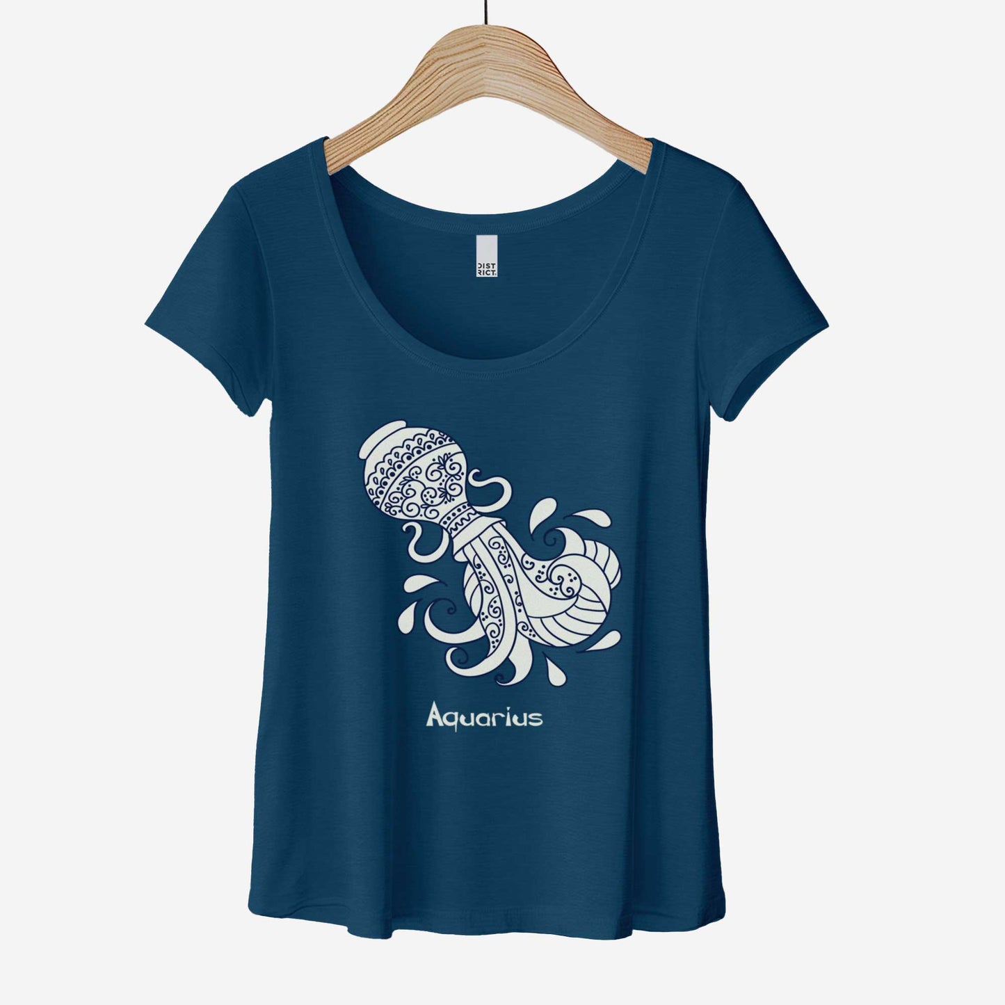 A hanging heathered neptune blue District 7501 scoop neck t-shirt featuring the zodiac symbol of Aquarius, a water jug, in a Mediterranean style illustration.