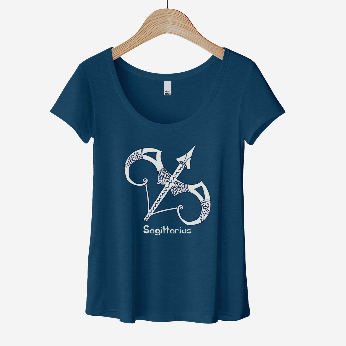 A hanging heathered neptune District 7501 scoop neck t-shirt featuring the zodiac symbol of Sagittarius, the bow and arrow, in a Mediterranean style illustration.