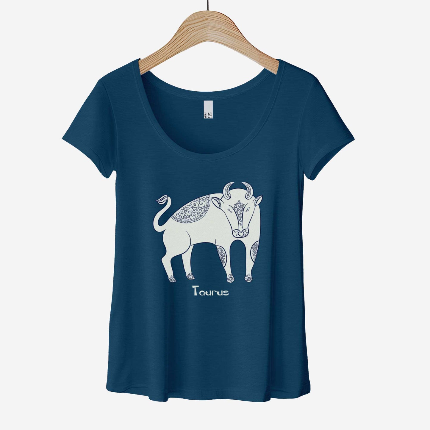 A hanging heathered neptune District 7501 scoop neck t-shirt featuring the zodiac symbol of Taurus, the bull, in a Mediterranean style illustration