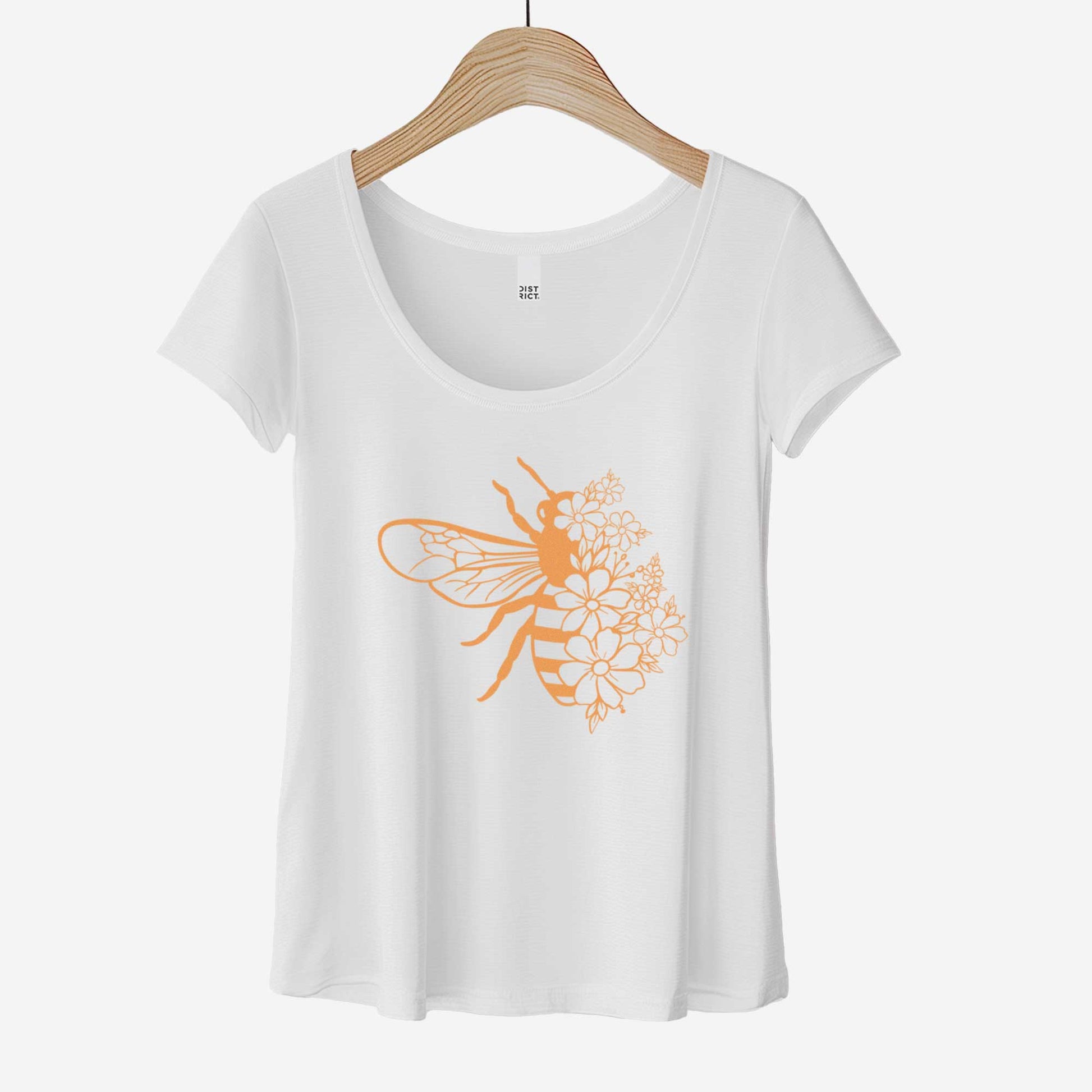 A white District 7501 scoop neck t-shirt featuring a bee illustration that is half made of pretty flowers.