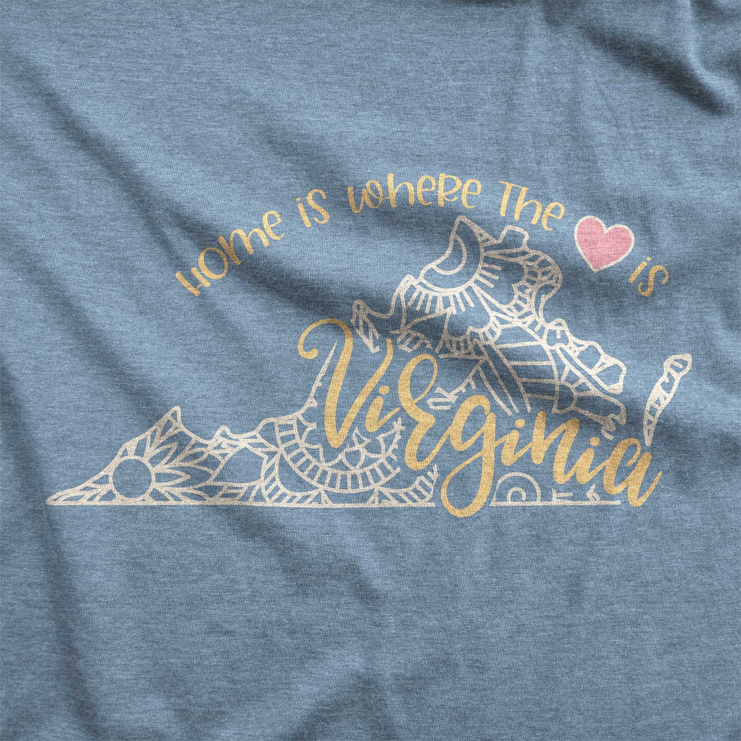 A heather slate Bella Canvas swatch featuring a mandala in the shape of Virginia with the words home is where the heart is.