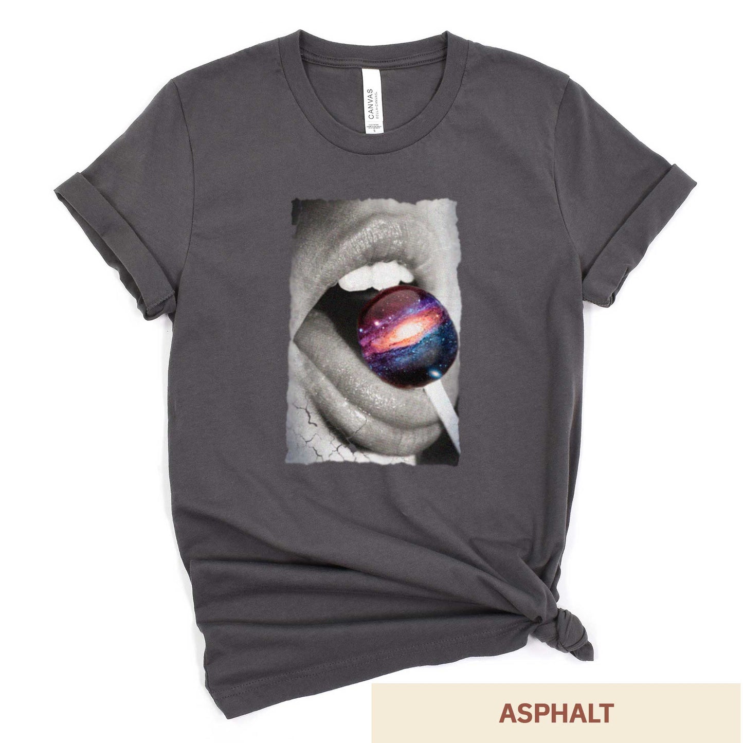 An asphalt grey Bella Canvas t-shirt with a black and white image of a woman's mouth eating a lollipop that looks like a swirling galaxy.