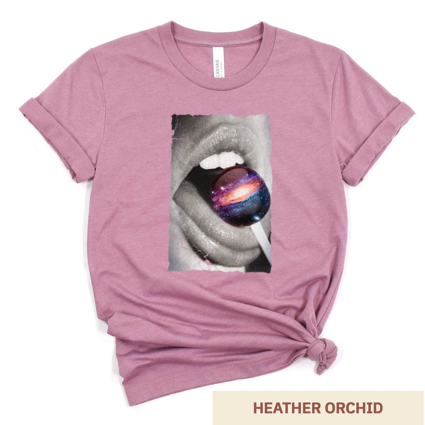 A heather orchid Bella Canvas t-shirt with a black and white image of a woman's mouth eating a lollipop that looks like a swirling galaxy.