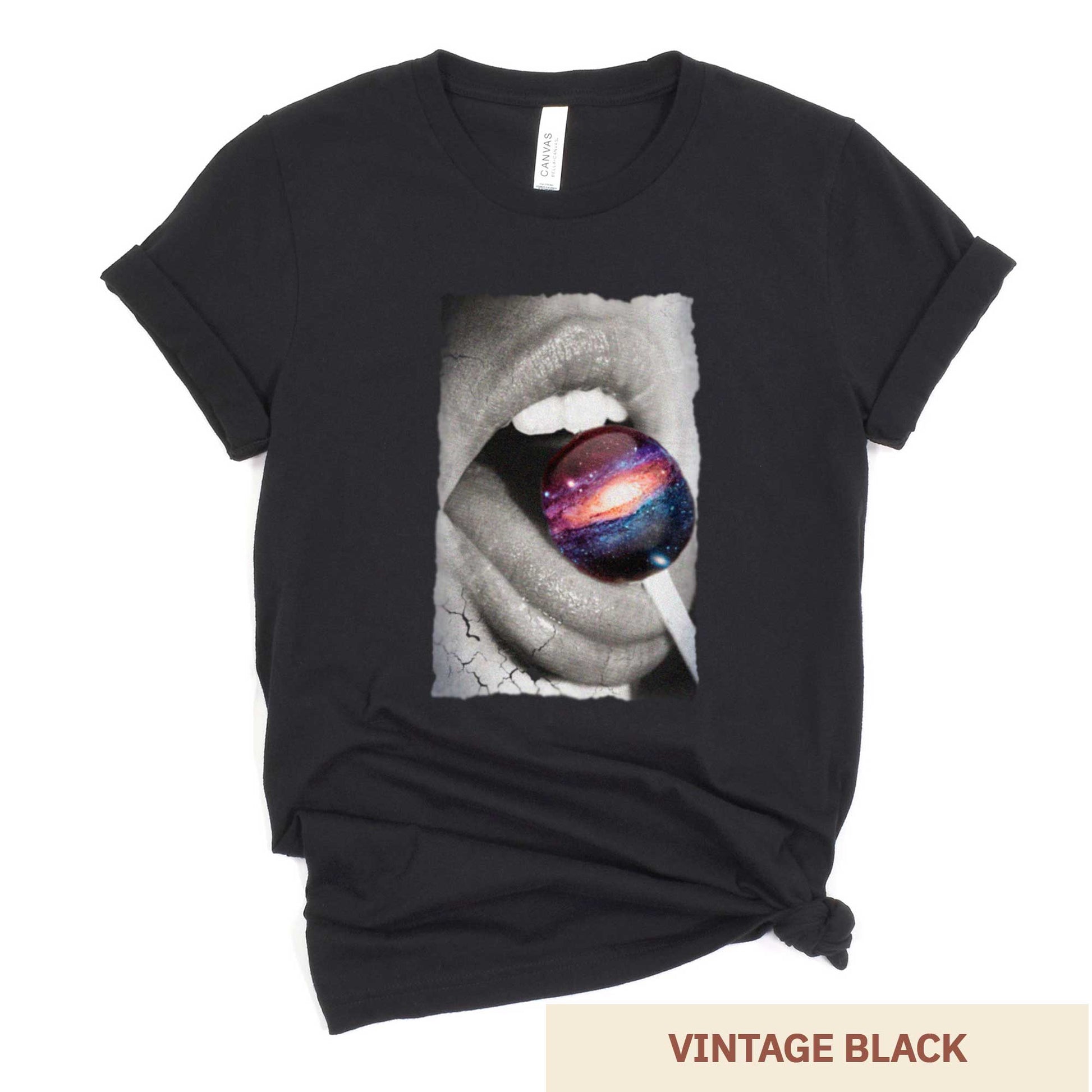 A vintage black Bella Canvas t-shirt with a black and white image of a woman's mouth eating a lollipop that looks like a swirling galaxy.