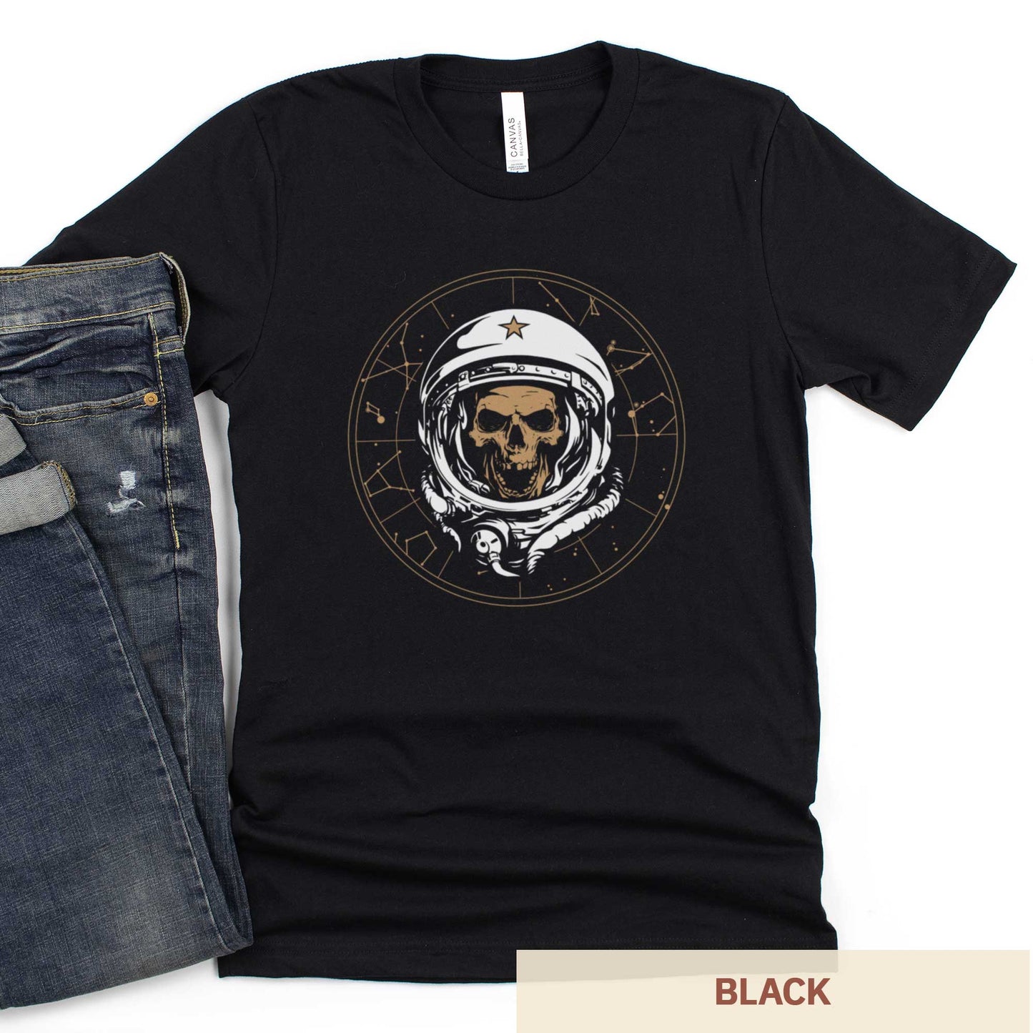 A black Bella Canvas t-shirt featuring a skull of astronaut breaking through the constellations in space.