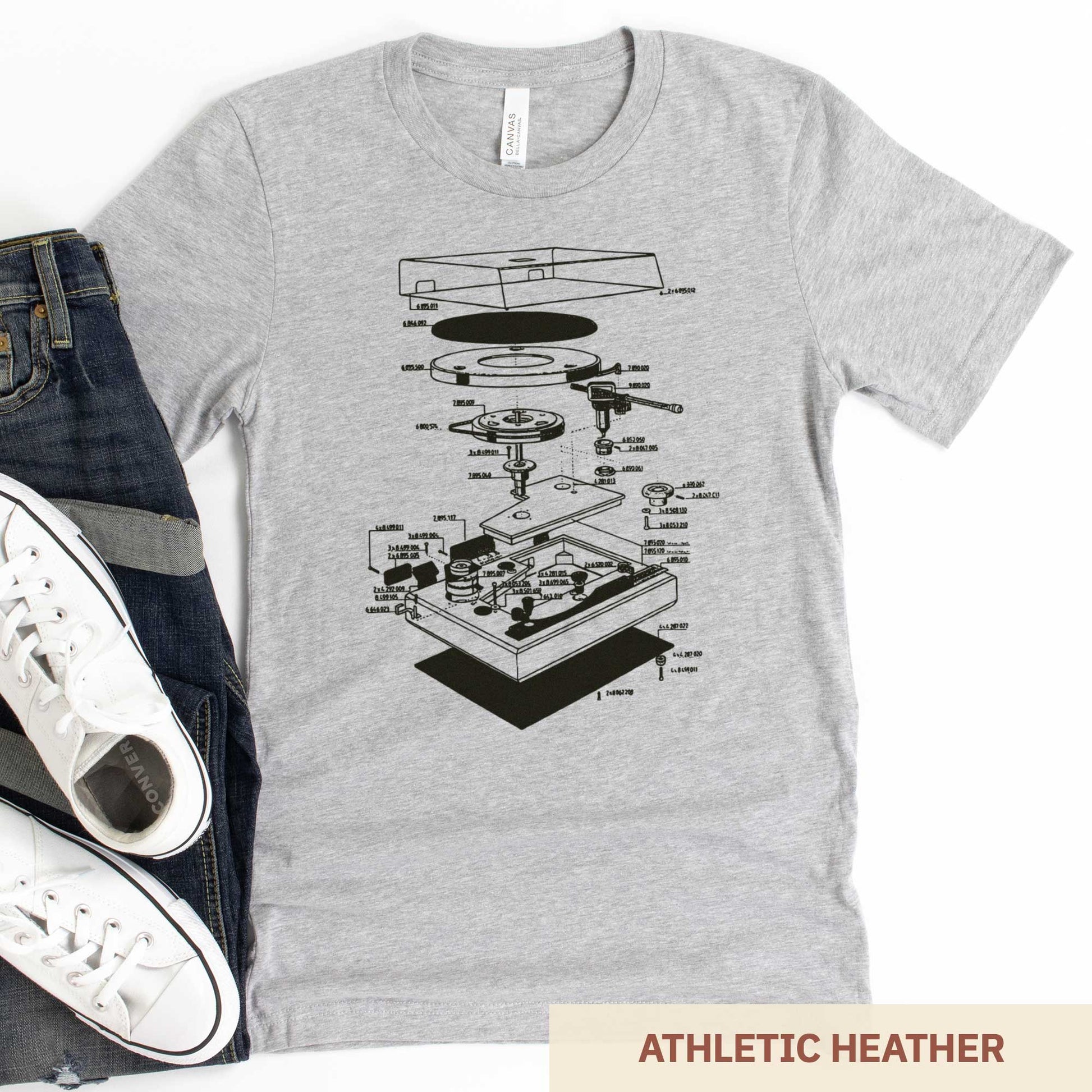 An athletic heather Bella Canvas t-shirt featuring an exploded view diagram of a turntable record player.