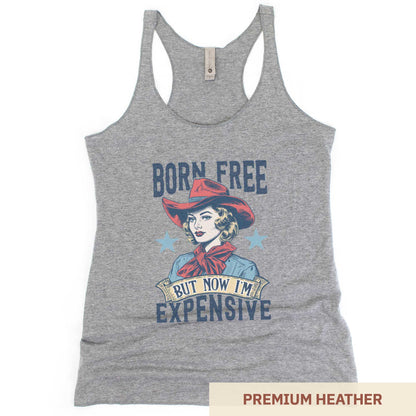 A premium heather Next Level racerback tank featuring a retro cowgirl with the words born free but now i'm expensive.