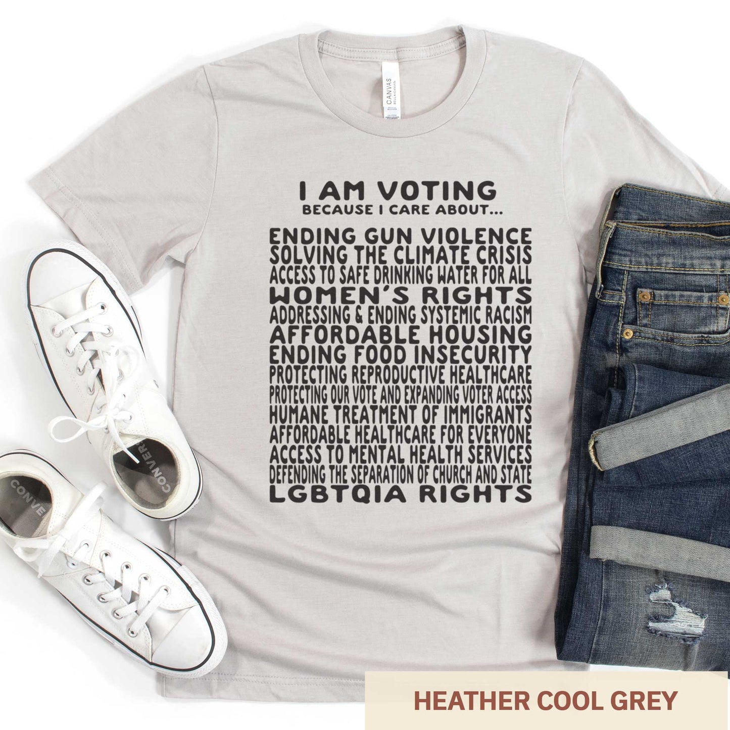 A heather cool grey Bella Canvas t-shirt featuring a long list of issues to vote on.