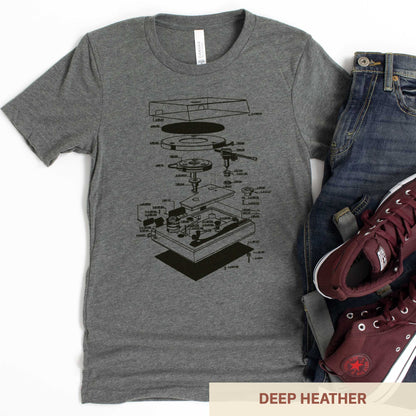 A deep heather Bella Canvas t-shirt featuring an exploded view diagram of a turntable record player.