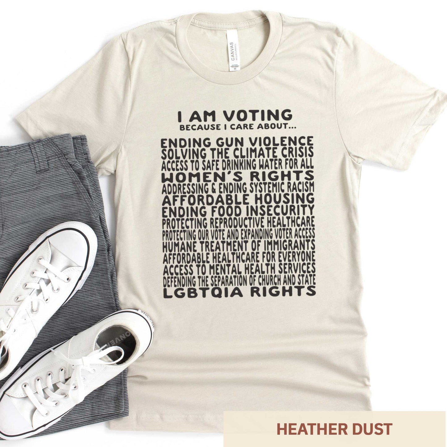 A heather dust Bella Canvas t-shirt featuring a long list of issues to vote on.
