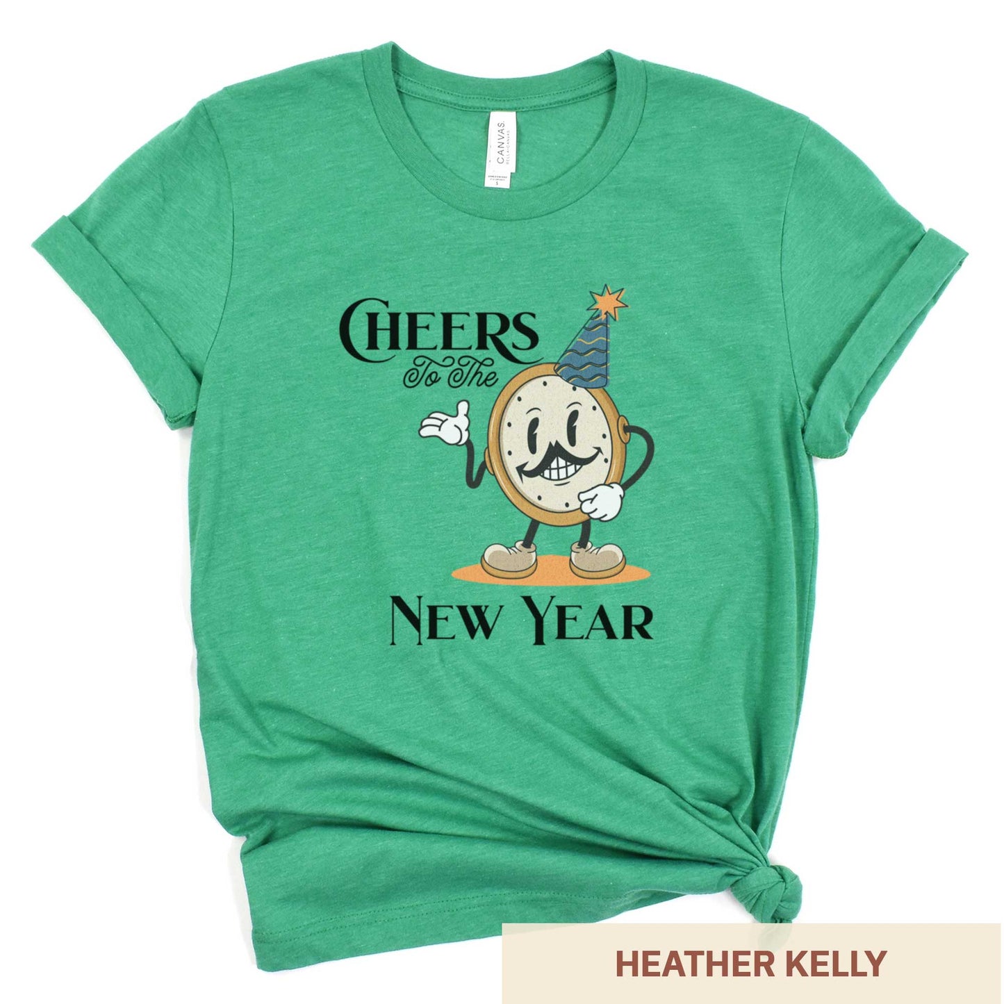 A heather kelly Bella Canvas t-shirt featuring a retro looking clock cartoon with a party hat next to the words Cheers to the New Year.