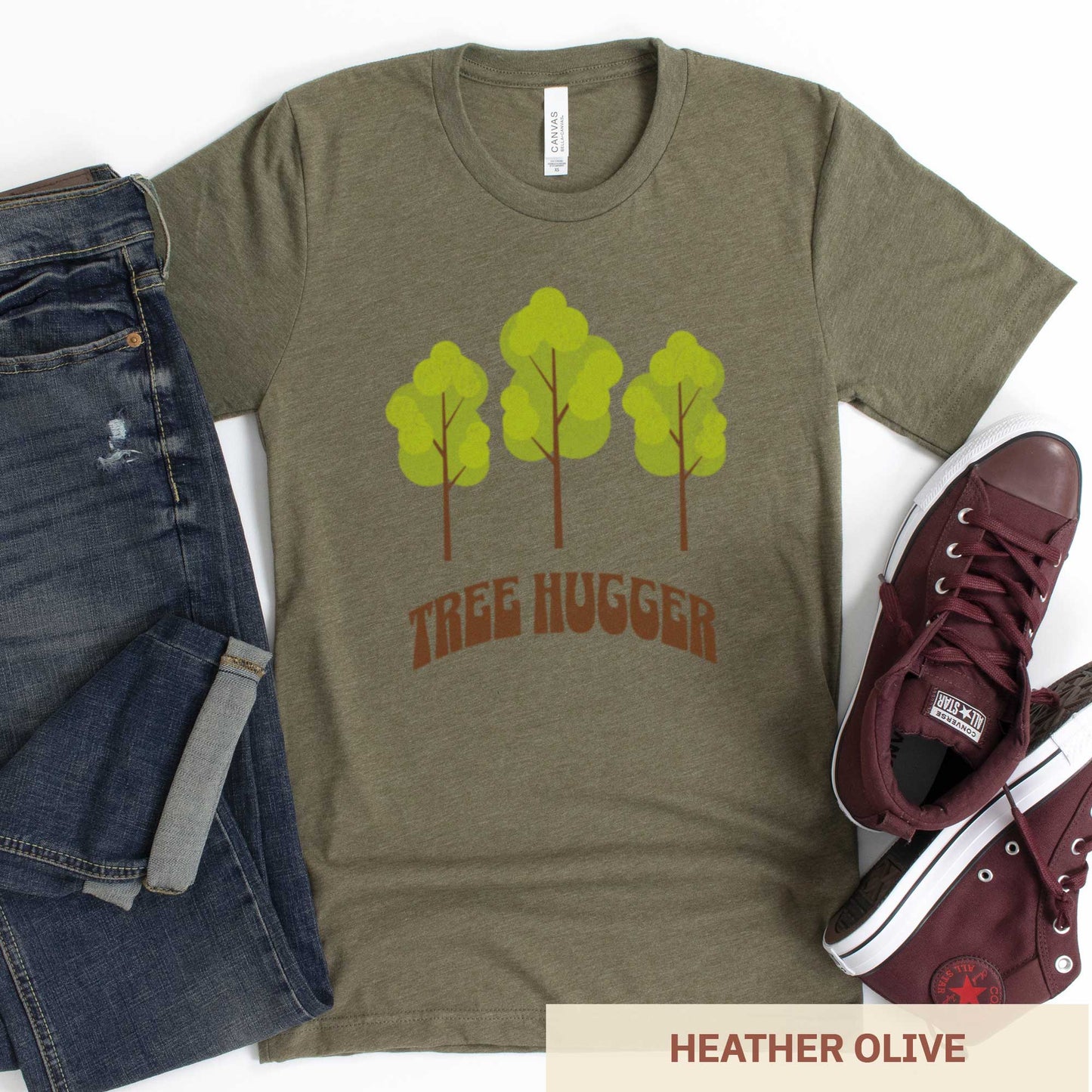 A heather olive Bella Canvas t-shirt featuring three trees and the words tree hugger.