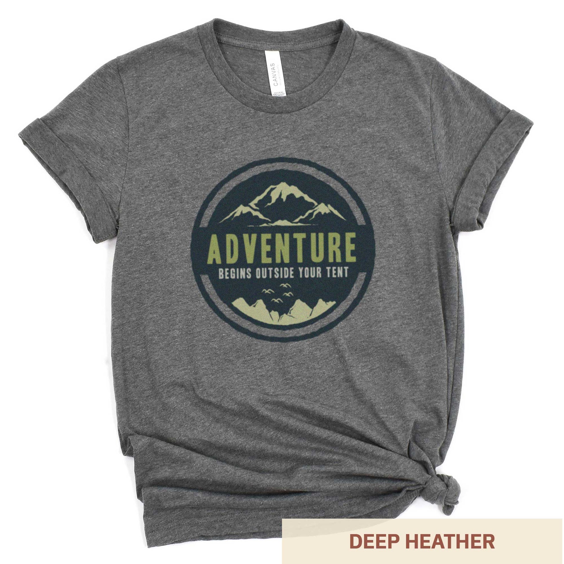 A deep heather Bella Canvas t-shirt that says adventure begins outside your tent.