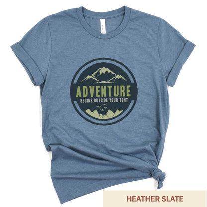 A heather slate Bella Canvas t-shirt that says adventure begins outside your tent.