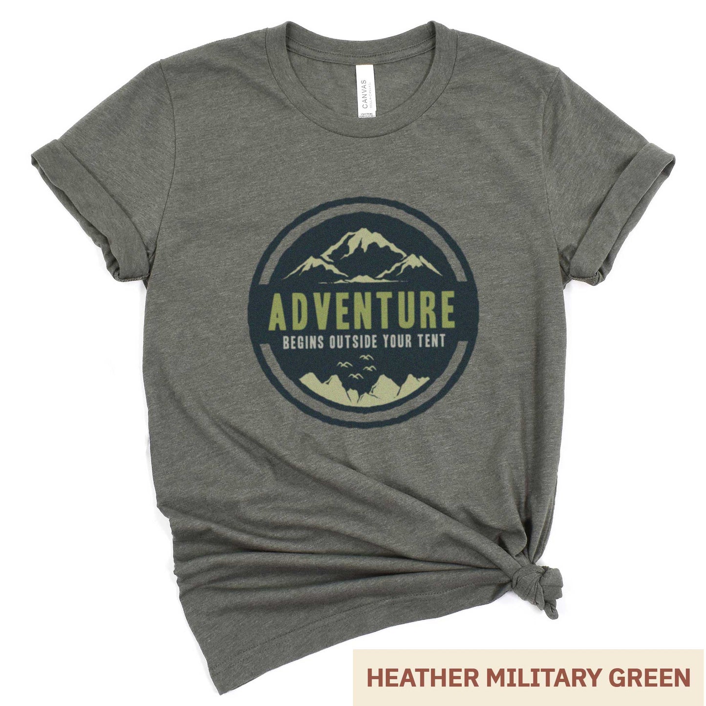 A heather military green Bella Canvas t-shirt that says adventure begins outside your tent.
