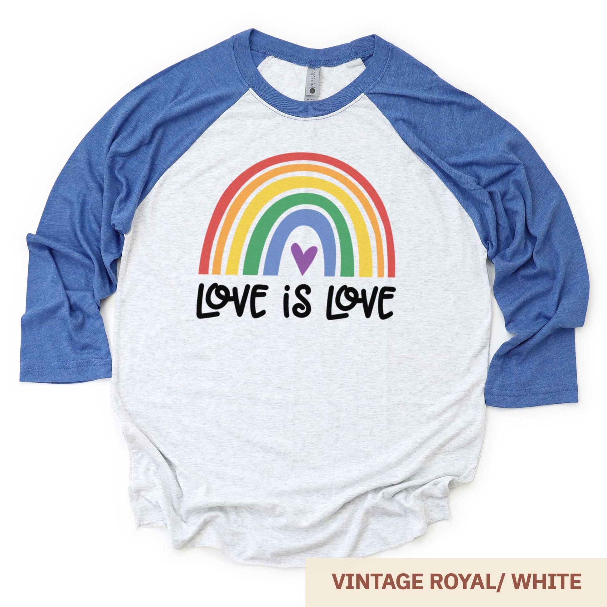 A vintage royal and heather white Next Level raglan swatch featuring a multi-colored rainbow with the words love is love below it.