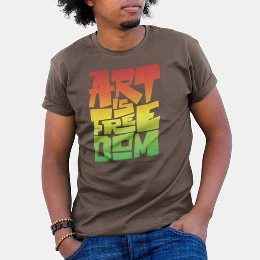 A man wearing an army green Bella Canvas t-shirt that says art is freedom in a red, yellow and green gradient.