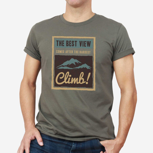 A man wearing an army green Bella Canvas t-shirt that features mountains and the words the best view comes after the hardest climb.