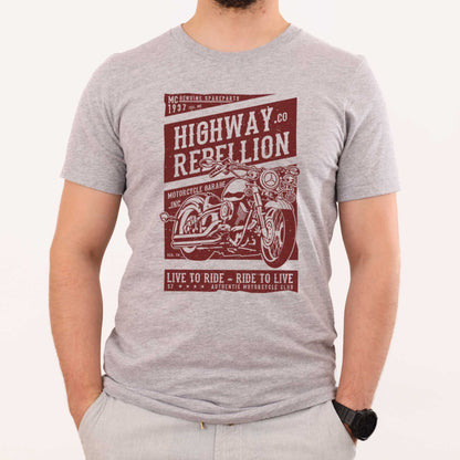 A man wearing an athletic heather grey Bella Canvas t-shirt featuring a motorcycle and the words highway rebellion live to ride - ride to live.