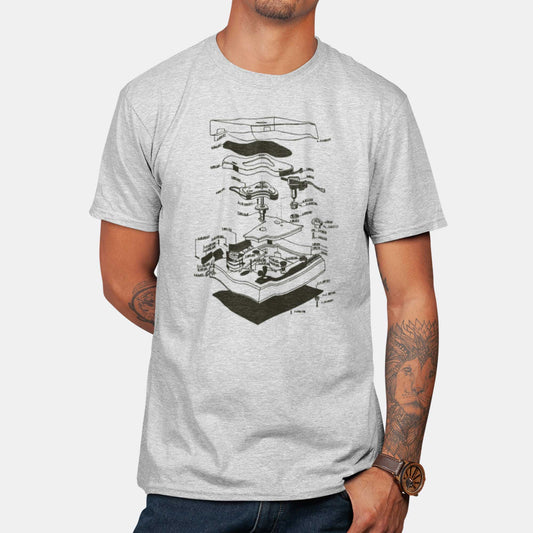 A man wearing an athletic heather Bella Canvas t-shirt featuring an exploded view diagram of a turntable record player.