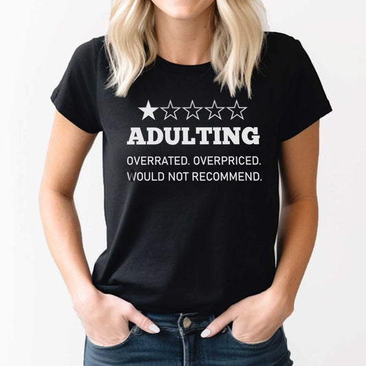 A woman wearing a black Bella Canvas t-shirt that says Adulting with one star.