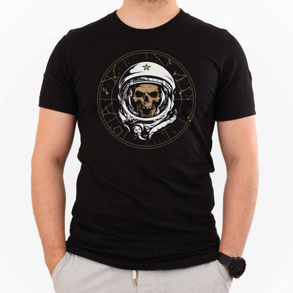 A man wearing a black Bella Canvas t-shirt featuring a skull of astronaut breaking through the constellations in space.