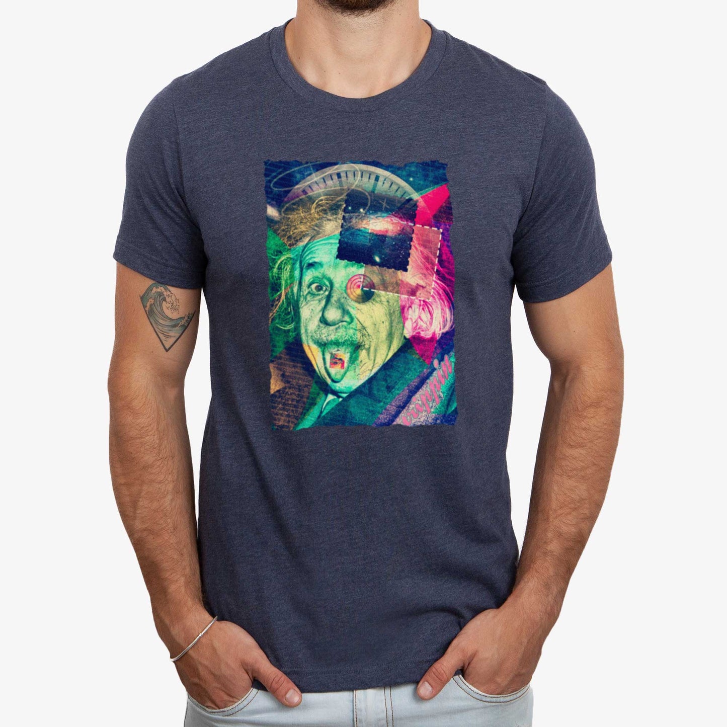 A man wearing a heather navy Bella Canvas t-shirt featuring the iconic Albert Einstein photo with his tongue out styled in a vaporwave aesthetic and a LSD paper on his tongue.