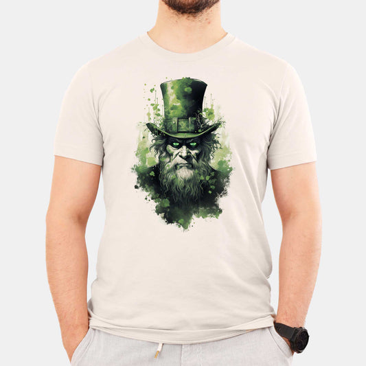 A man wearing a heather dust Bella Canvas t-shirt featuring an evil leprechaun with glowing green eyes.