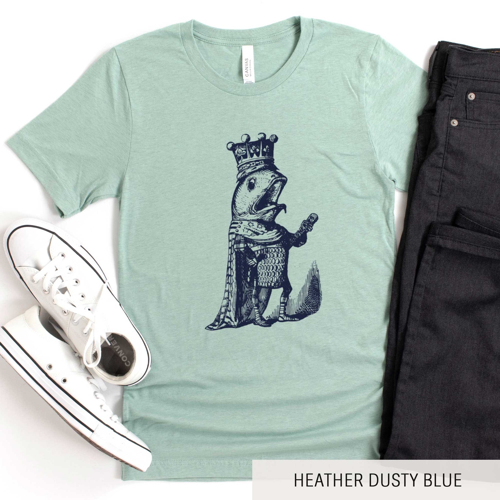 A heather dusty blue Bella Canvas t-shirt featuring a vintage illustration of a talking fish dressed in the royal robes of a king.