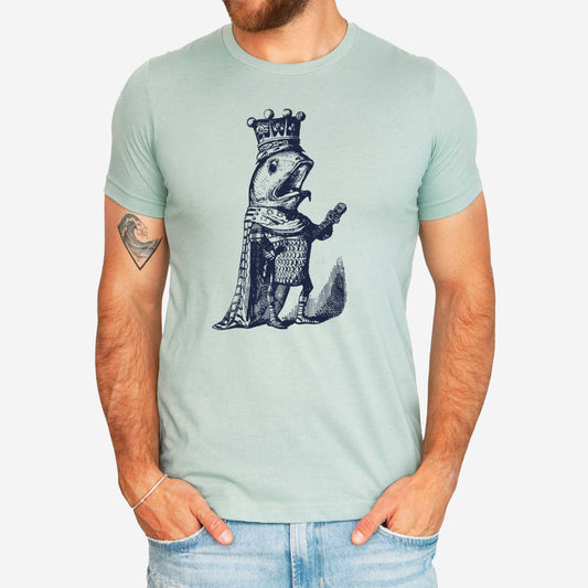 A man wearing a heather dusty blue Bella Canvas t-shirt featuring a vintage illustration of a talking fish dressed in the royal robes of a king.