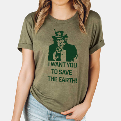 A woman wearing a heather olive Bella Canvas t-shirt featuring Uncle Sam and the words I want you to save the Earth.