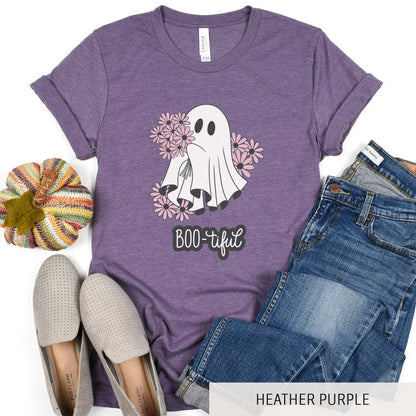 A heather purple Bella Canvas t-shirt featuring a cute cartoon ghost surrounded by flowers and the words boo-tiful.