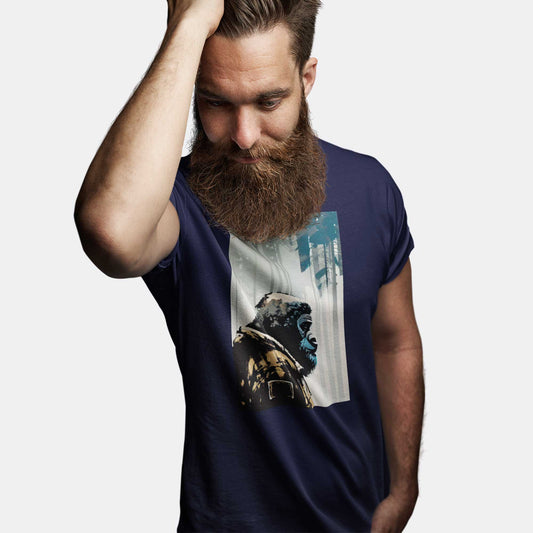 A man wearing a navy Bella Canvas t-shirt featuring a highly-intelligent non-human ape species exploring the wilderness.
