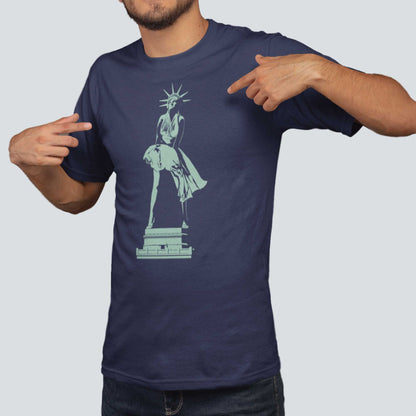 A man wearing a navy Bella Canvas t-shirt featuring the Statue of Liberty dressed up as Marilyn Monroe's character from the Seven Year Itch. 