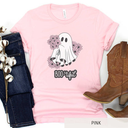 A pink Bella Canvas t-shirt featuring a cute cartoon ghost surrounded by flowers and the words boo-tiful.