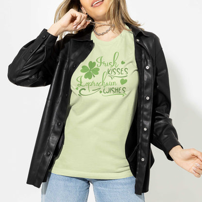 A woman wearing a spring green Bella Canvas t-shirt with a shamrock and the words irish kisses leprachaun wishes