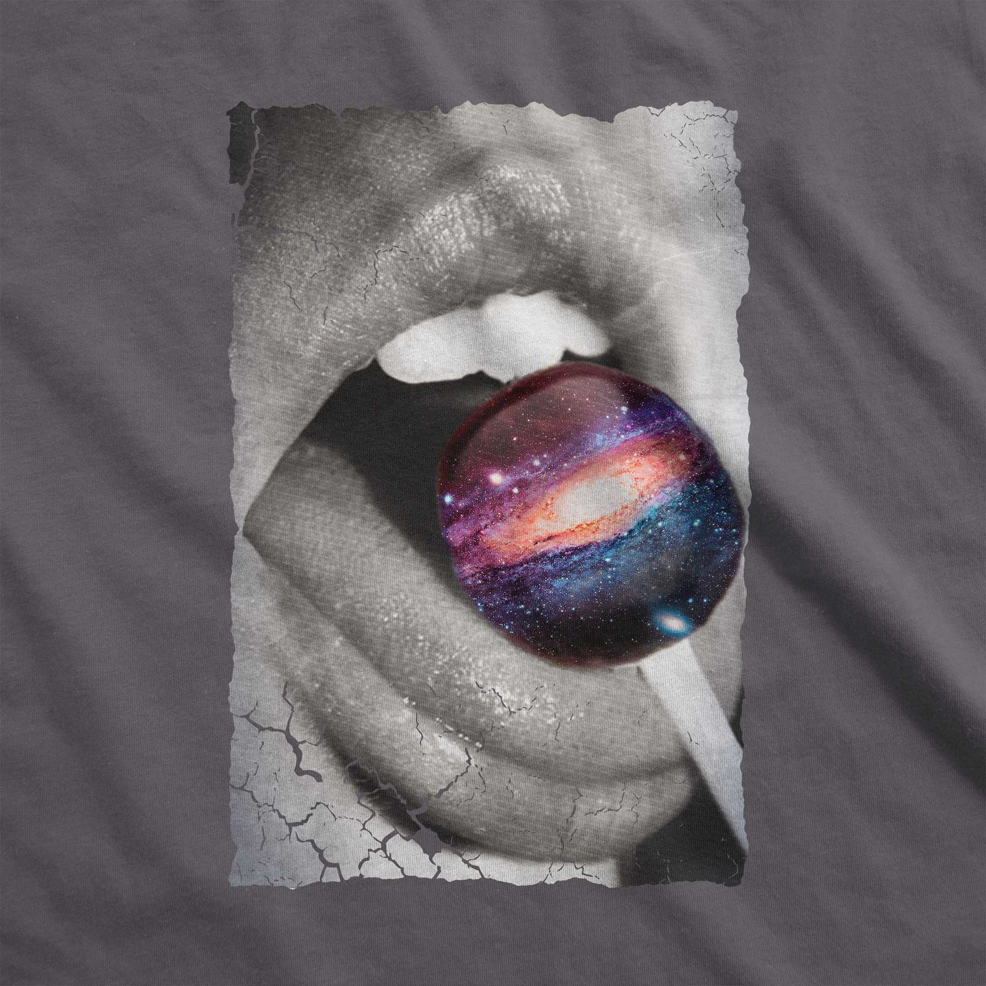 An asphalt grey Bella Canvas swatch with a black and white image of a woman's mouth eating a lollipop that looks like a swirling galaxy.