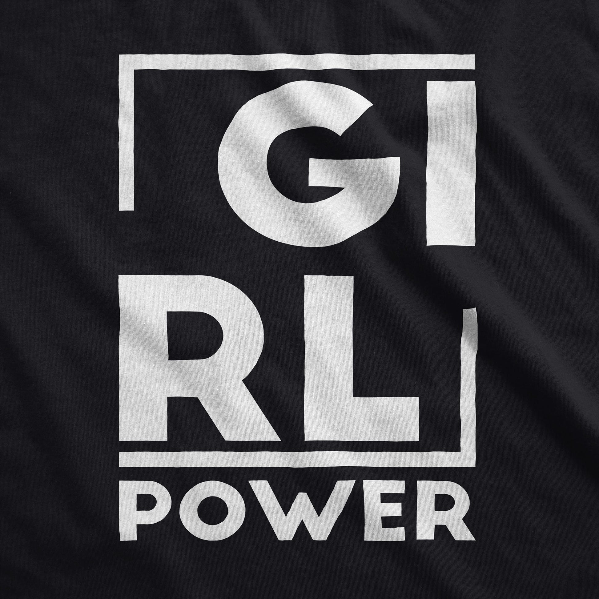 A black District 7501 swatch featuring the words girl power.