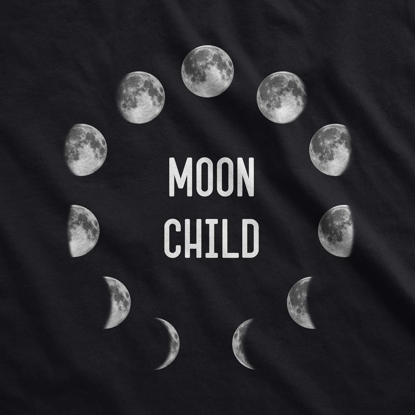 A black District 7501 swatch with the phases of the moon in a circle and the words moon child in the center.