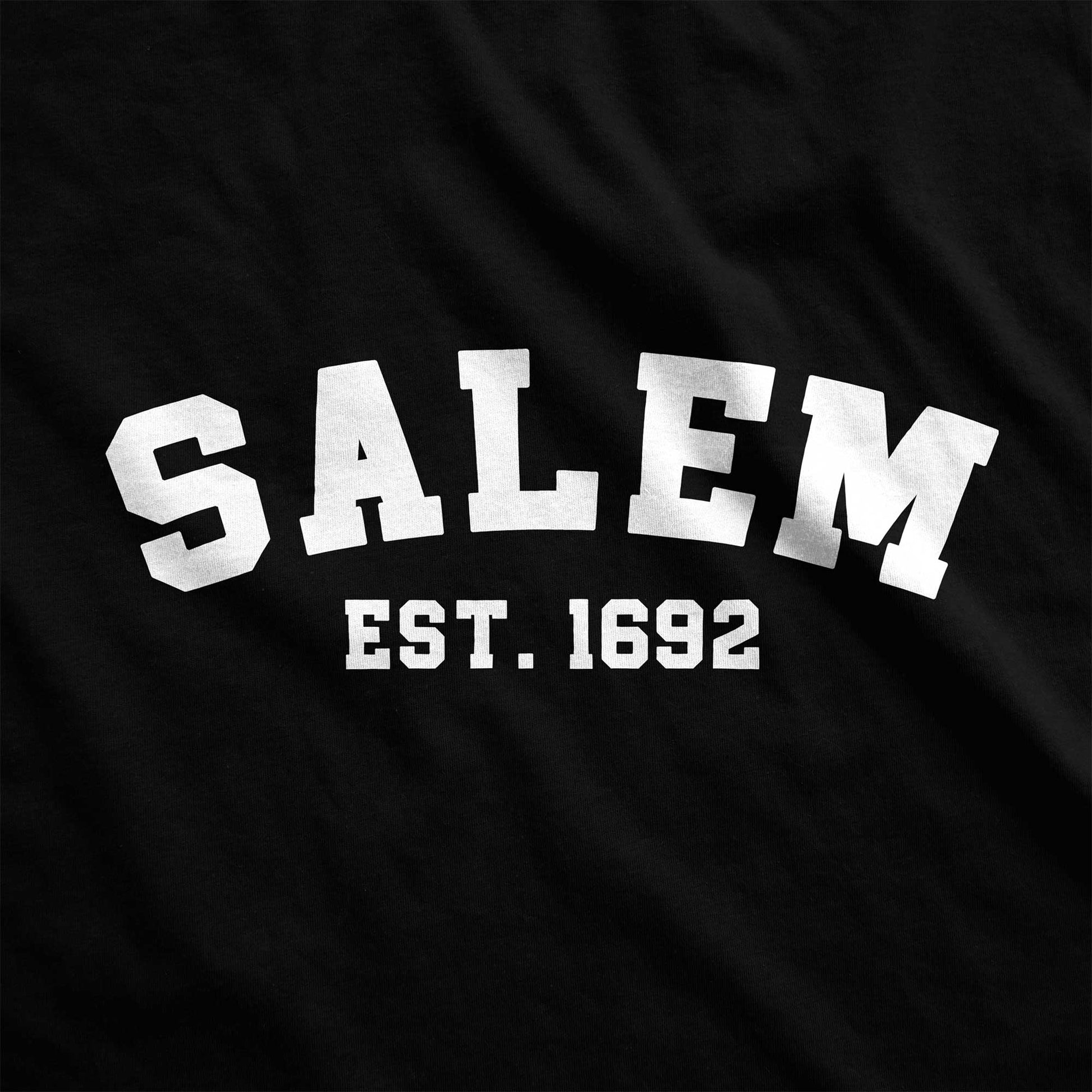 A black Bella Canvas swatch that says Salem Est. 1692.