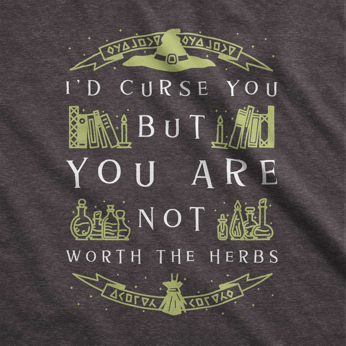 A dark grey heather Bella Canvas swatch with a witch's hat, books and potions and the words I'd curse you but you are not worth the herbs.
