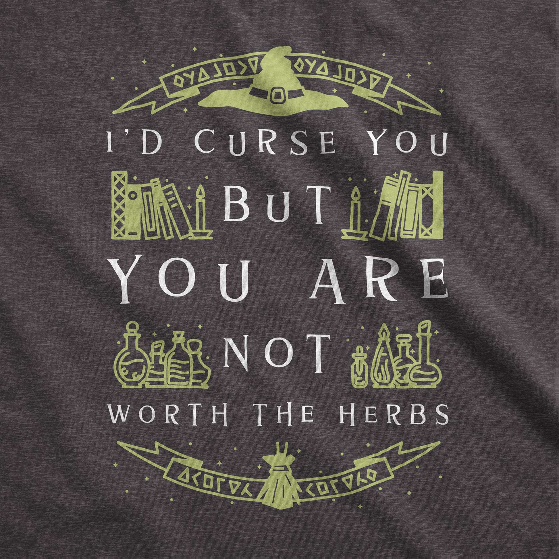 A dark grey heather Bella Canvas swatch with a witch's hat, books and potions and the words I'd curse you but you are not worth the herbs.
